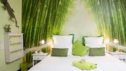Bedroom with green bedspread photo