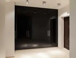 Black wardrobe in the hallway interior