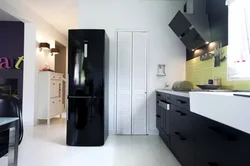 White kitchen black refrigerator photo