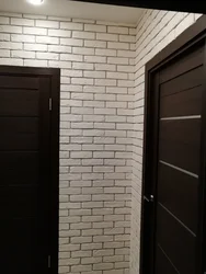 Hallway with white bricks photo