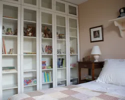 Bedroom with bookcase photo