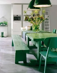 Photo of a kitchen with green chairs