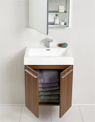 Cabinet with sink for a small bathroom photo