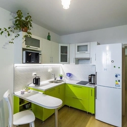 Small corner kitchen in studio design