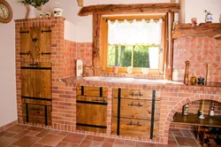 Photo of a kitchen made of wood and brick