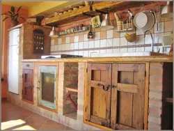 Photo Of A Kitchen Made Of Wood And Brick