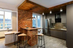 Photo of a kitchen made of wood and brick
