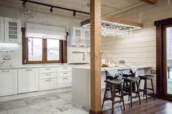 Photo of a white kitchen in a wooden house