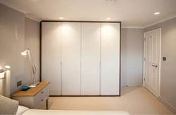 Photo of a bedroom closet up to the ceiling