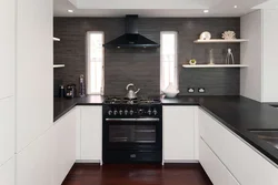 Light kitchen design with dark apron