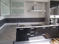 Kitchen with dark gray countertop photo