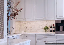 White kitchen with marble splashback photo