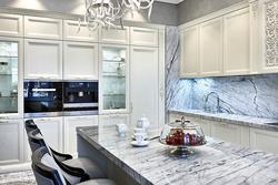 White kitchen with marble splashback photo