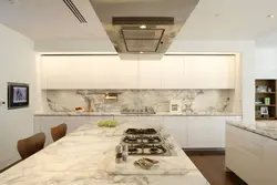 White kitchen with marble splashback photo