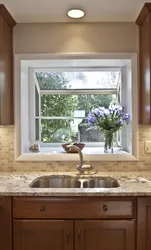 Sink by the window in the bathroom photo