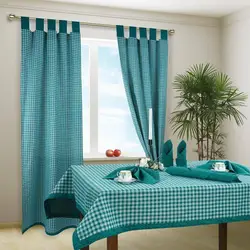 Kitchen interior with turquoise curtains photo