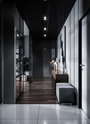 Photo of a hallway with a black floor