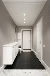 Photo of a hallway with a black floor