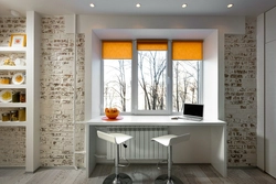 Wide window sill in the kitchen design