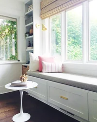 Wide window sill in the kitchen design