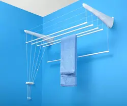Wall-mounted dryer in the bathroom photo