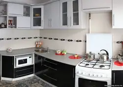 Kitchen with a regular stove photo