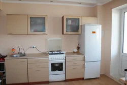 Kitchen with a regular stove photo