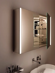 Photo of a wardrobe with a mirror in the bathroom