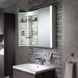 Photo of a wardrobe with a mirror in the bathroom