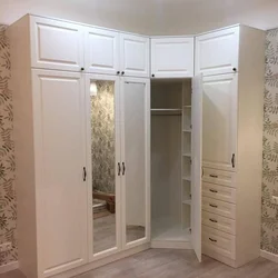 Corner wardrobe in a small bedroom photo