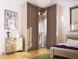 Corner wardrobe in a small bedroom photo