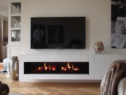 Built-in bio-fireplace in the living room interior photo