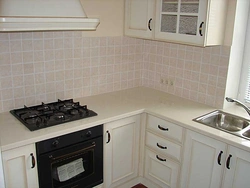 White Kitchen With Black Stove Photo