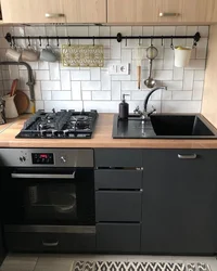 White kitchen with black stove photo