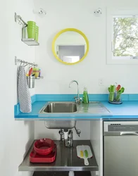 Sink against the kitchen wall photo