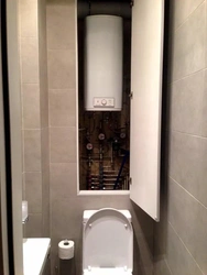 Photo Of A Toilet In An Apartment With A Boiler