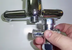 Photo Of A Disassembled Faucet With Bathtub