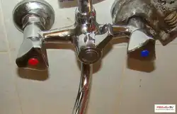 Photo Of A Disassembled Faucet With Bathtub