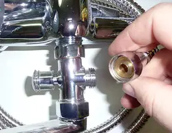 Photo of a disassembled faucet with bathtub