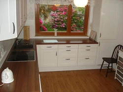 Cabinet By The Window In The Kitchen Photo