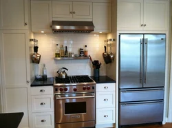 Kitchens with gas stove and refrigerator photo