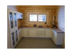 Kitchen In A Wooden House With A Sink By The Window Photo