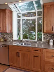 Kitchen In A Wooden House With A Sink By The Window Photo