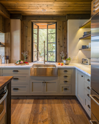 Kitchen in a wooden house with a sink by the window photo