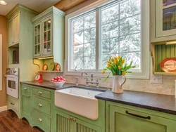 Kitchen In A Wooden House With A Sink By The Window Photo