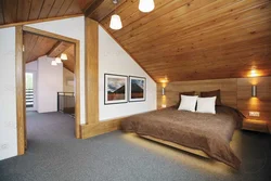 Bedroom design in a house with a wooden ceiling
