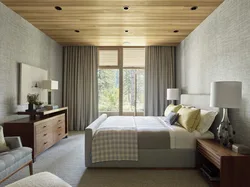 Bedroom design in a house with a wooden ceiling