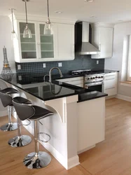 White and black kitchens with bar counters photo