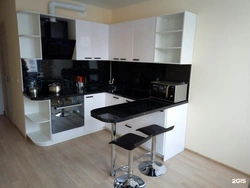 White And Black Kitchens With Bar Counters Photo