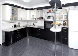White and black kitchens with bar counters photo